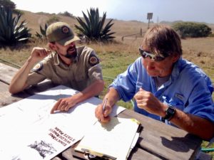 While field-checking his California's Lost Coast map, Trailmaster John McKinney gets the latest info from a Sinkyone Wilderness State Park ranger.